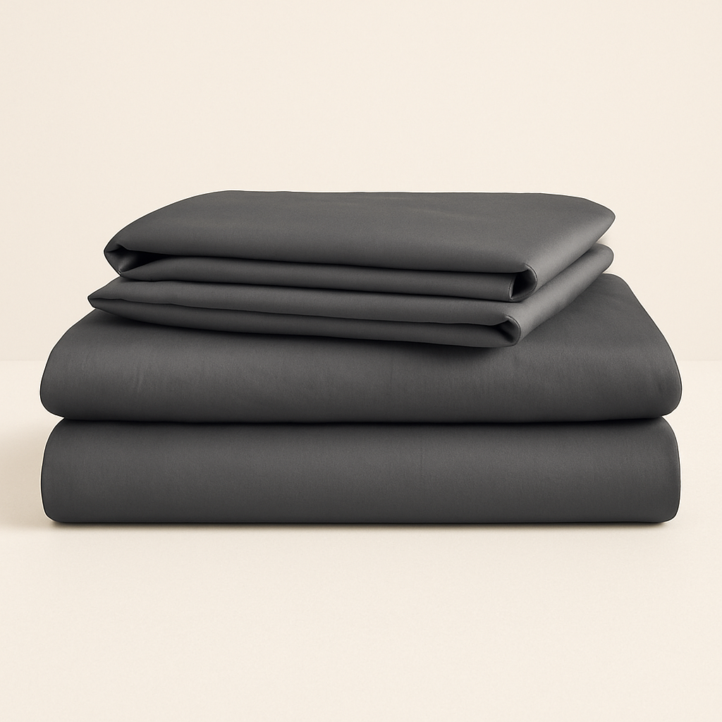 Make your bed the centerpiece of calm. This 4-piece charcoal grey sheet set blends sleek design with breathable comfort.