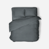 Make your bed the centerpiece of calm. This 4-piece charcoal grey sheet set blends sleek design with breathable comfort.