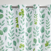 Shower curtain with green leaf pattern in a bathroom setting