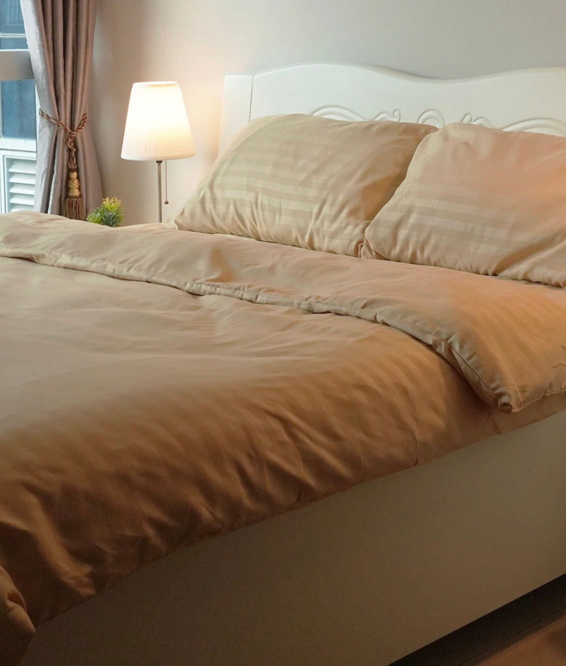 Minimalist bedroom with striped brown duvet and matching pillows
