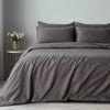 Cotton grey striped duvet cover draped over a modern bed